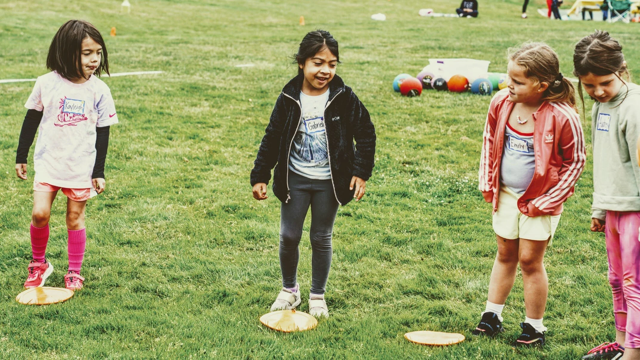 Girls learning football skills at Girls Sports Club clinic