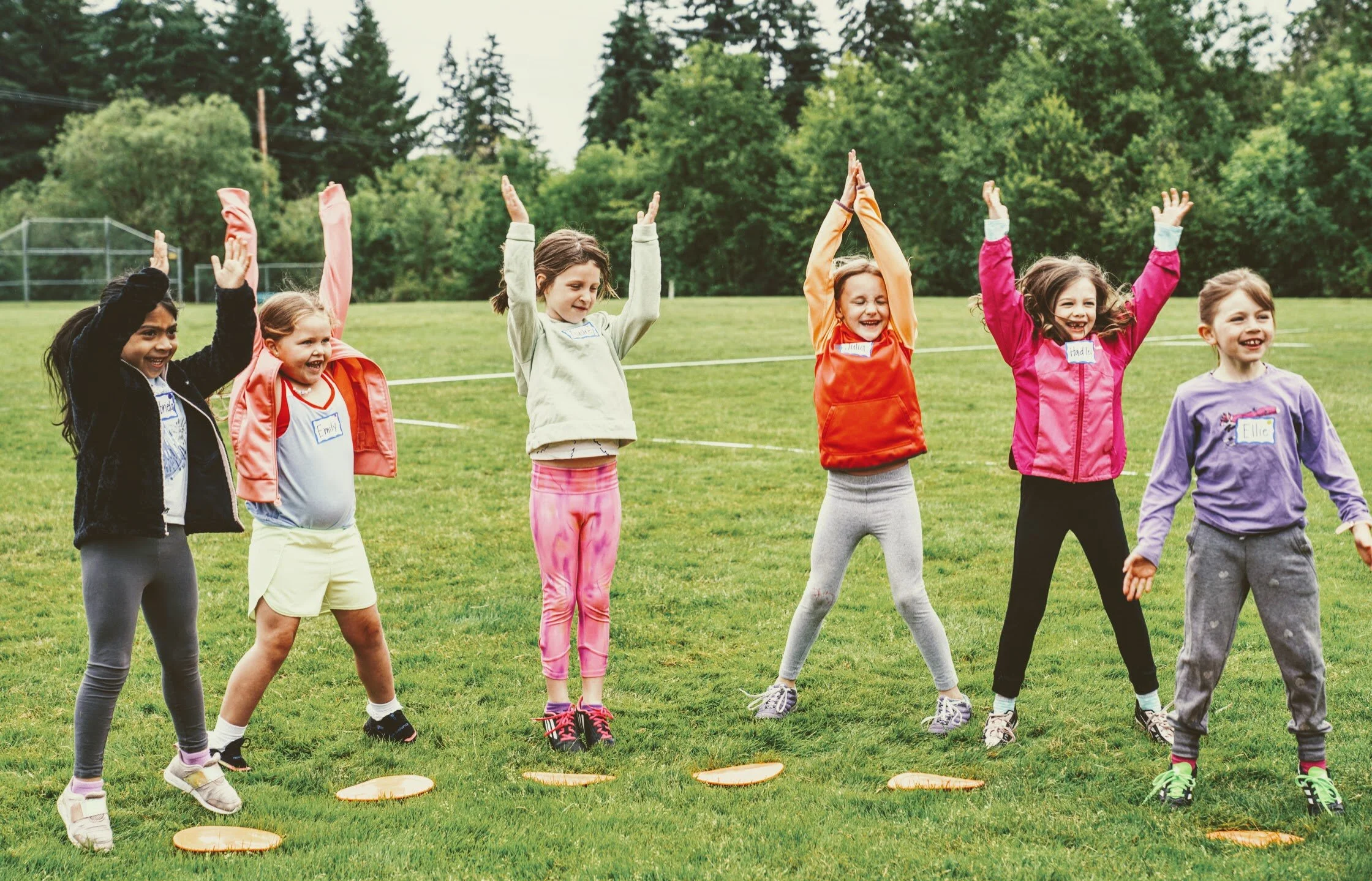 Girls learning football skills at Girls Sports Club clinic