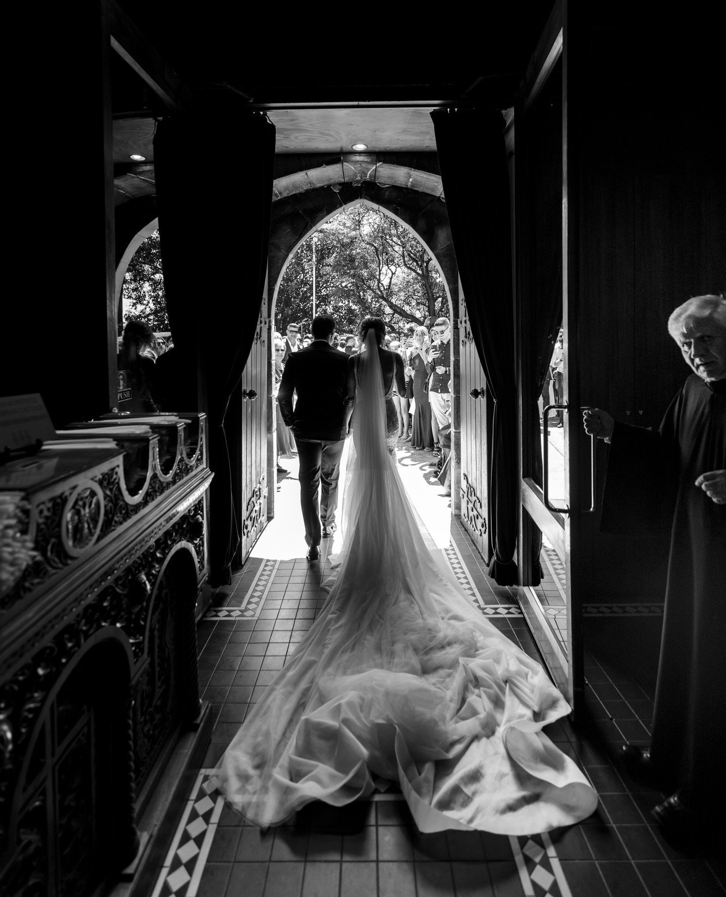 Top &quot;Not Posed&quot; Photos - Part 1⁠
⁠
Leaving and entering your church. ⁠
⁠
Especially in black and white, when the dark background of your church creates a contrasting background for the white of your dress, often highlighting the train and/o