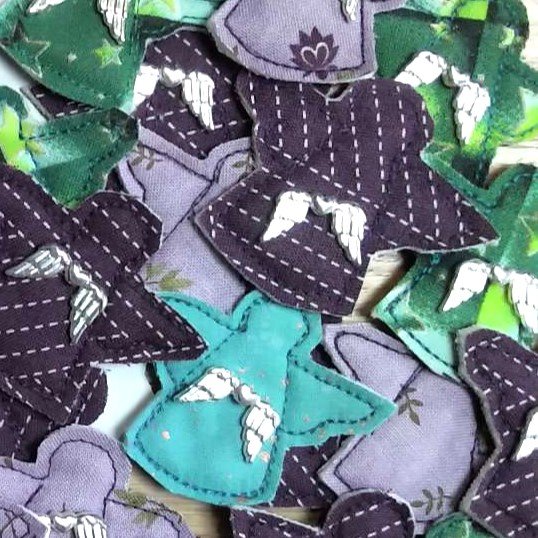 a selection of purple and green pocket angels