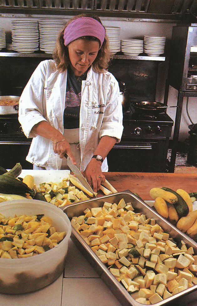 Marian preparing squash in the Straight Wharf kitchen. From 'The Victory Garden Cookbook', 1982.