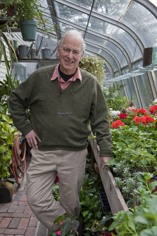 Russell in his greenhouse.