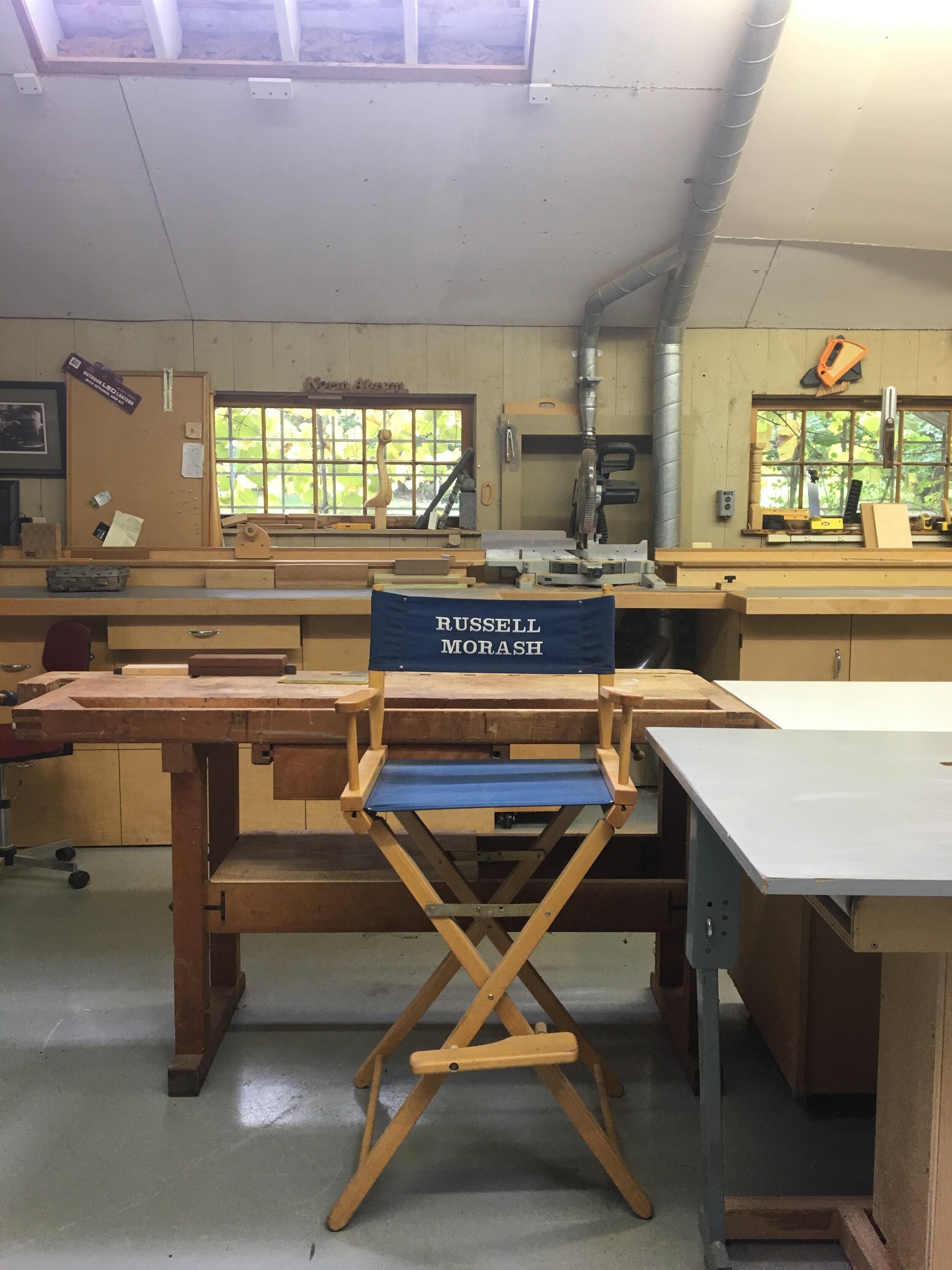 Russell Morash's director's chair with Norm Abram's nameplate above the window. (Photo by author).