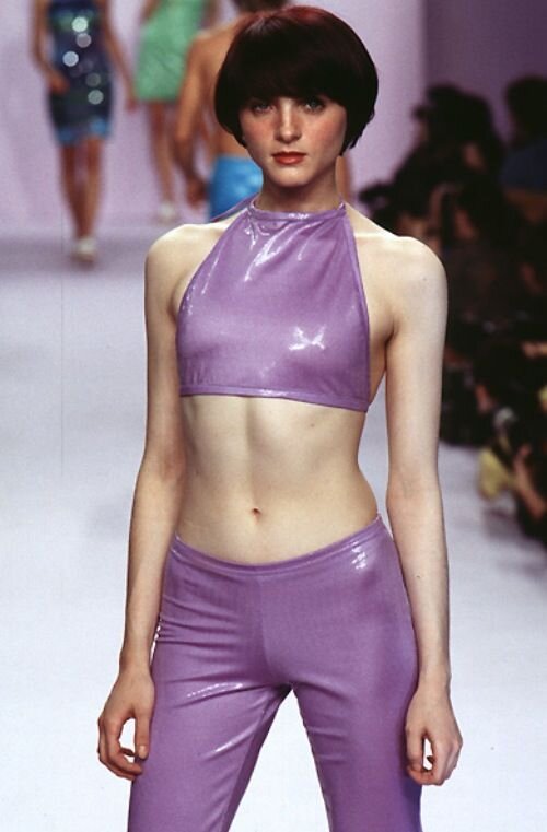 Michele Hicks modeling a PVC outfit in Sui's s/s 1996 show.
