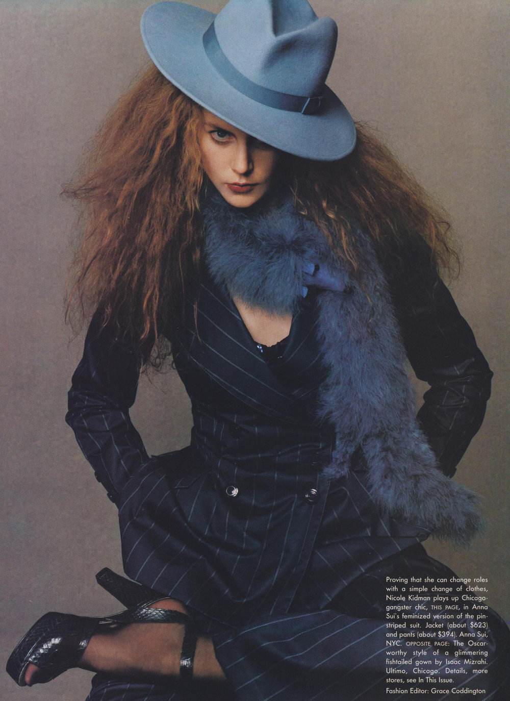 Nicole Kidman in a Sui pinstripe suit. Shot by Steven Meisel for Vogue, February 1995.