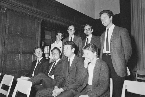 Eight students suspended from Berkeley on Sept 30th, 1964 for operating a table on campus without a permit. David Lance Goines can be seen top left.