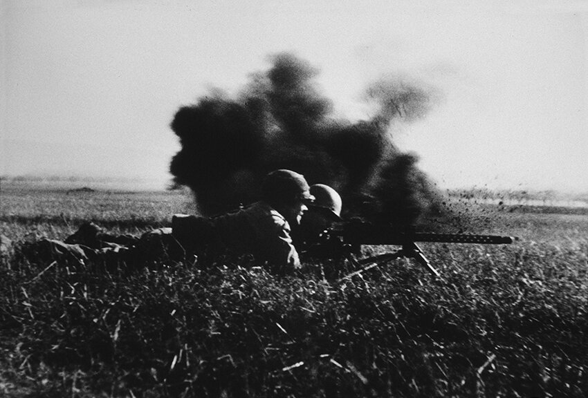 vaccaro_ put my hand up with the camera to catch this machine gun team in action just as a German mortar exploded, near Walternienburg, Germany, April, 1945..jpg