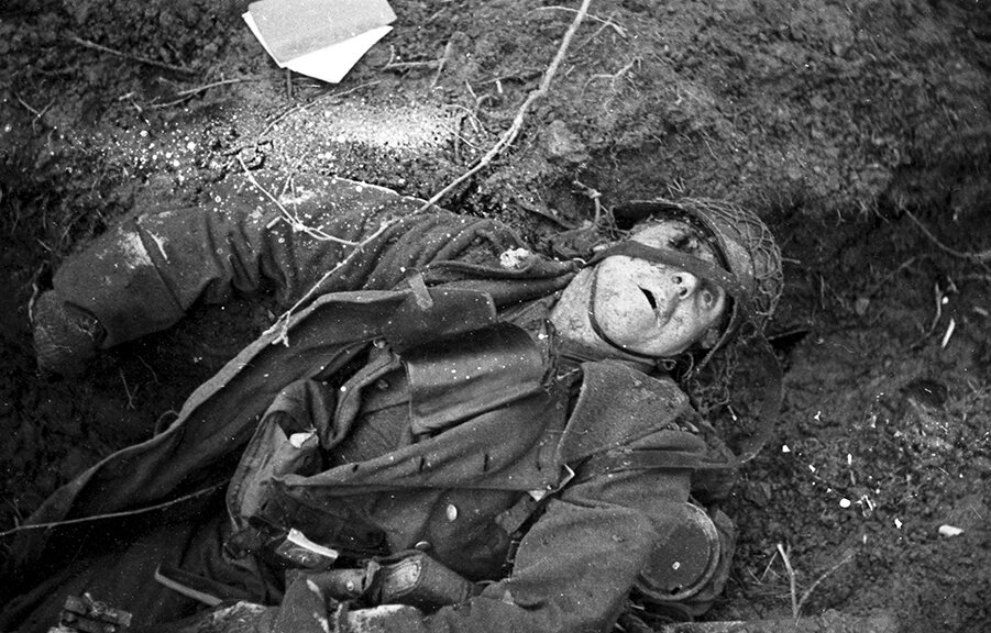 vaccaro_A dead German soldier at a machine gun nest has fallen near a newly opened Christmas card, Hurtgen Forest, Germany, December 20, 1945..jpg