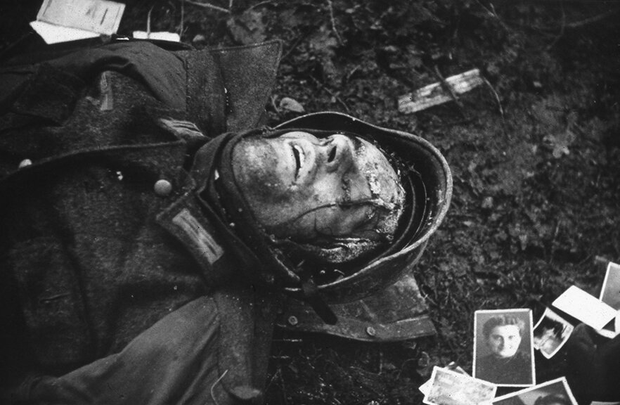 vaccaro_A dead German soldier lies amongst photos of his family, Hurtgen Forest, Germany, January, 1945..jpg