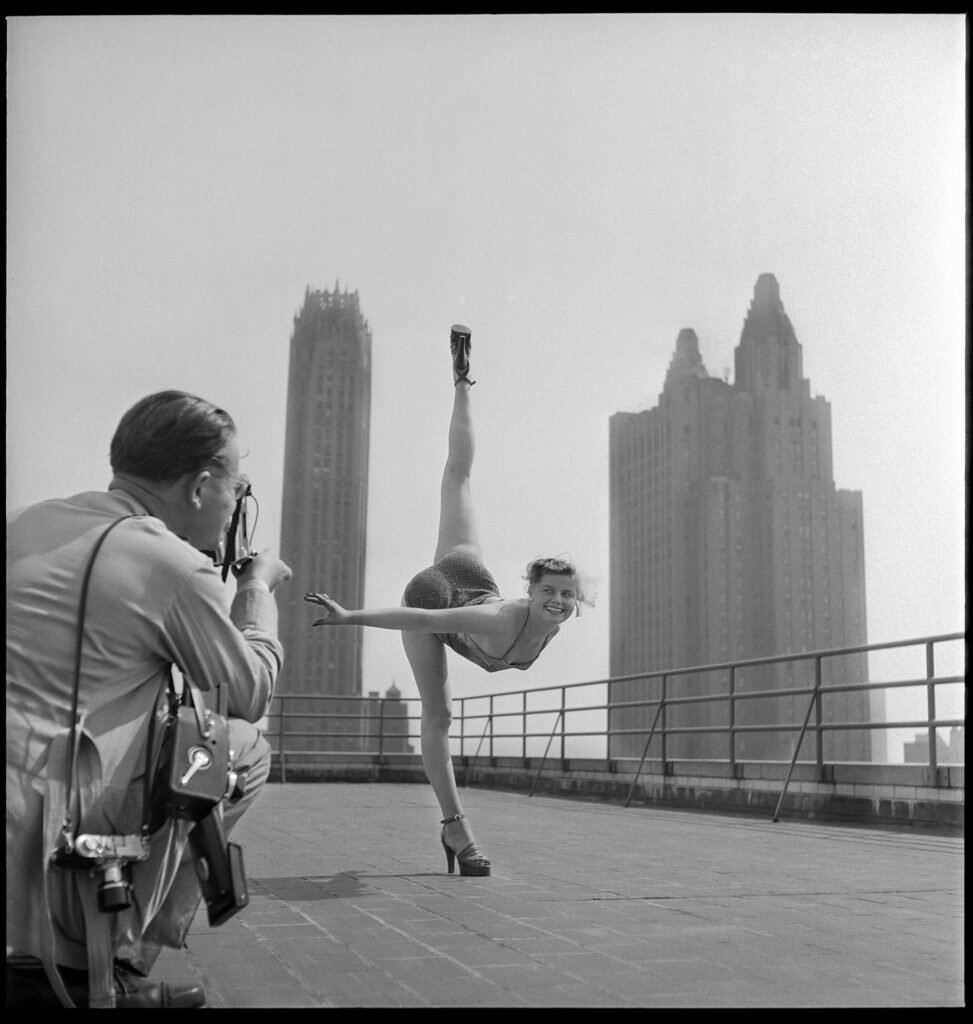 Photographer Hanns Hubman snaps a photo of an early 1950's "Miss Germany"