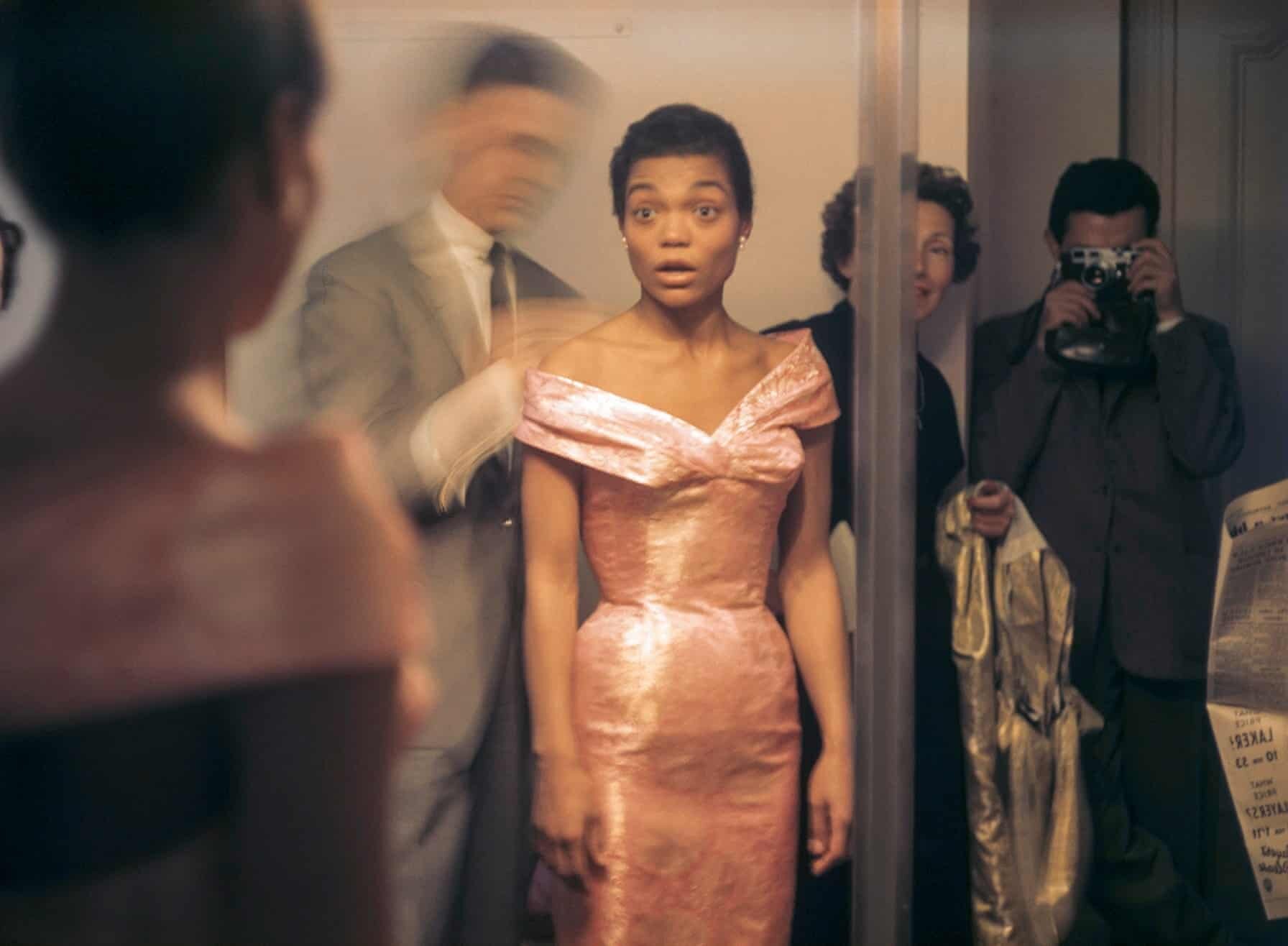 Eartha Kitt looks at her reflection during a fitting with Hubert de Givenchy in Paris, 1961.