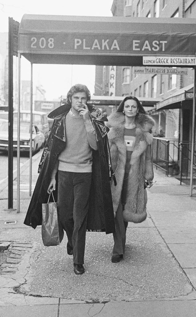 Diane walks down a sidewalk in New York with her then-husband Egon von Furstenberg. Susan Wood.jpg