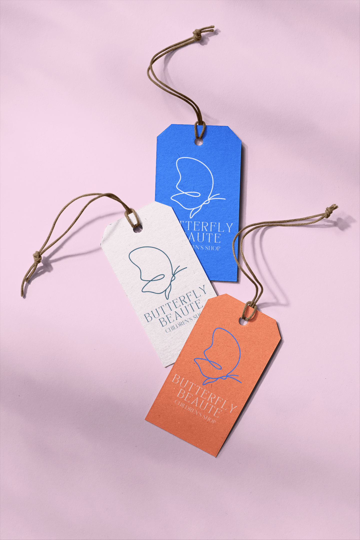 mockup-of-three-brand-tags-on-a-plain-surface-27649.png