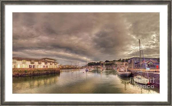 Porthmadog harbour at Dusk framed print by Catchavista at Fineartamerica