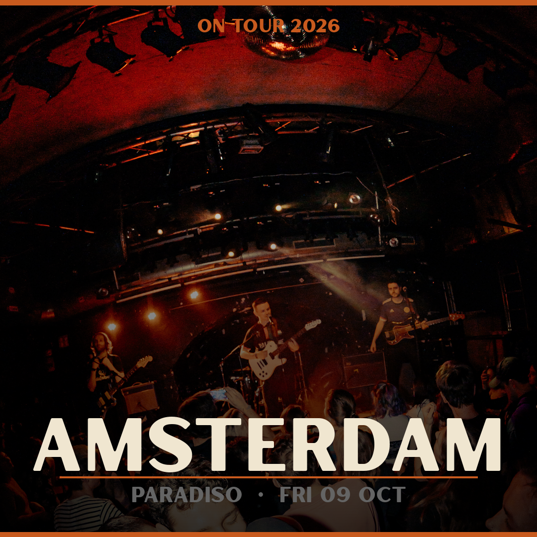 Concert scene with band performing on stage, audience watching, with text overlay indicating Amsterdam, Paradiso, Friday, October 9, 2026, on tour.
