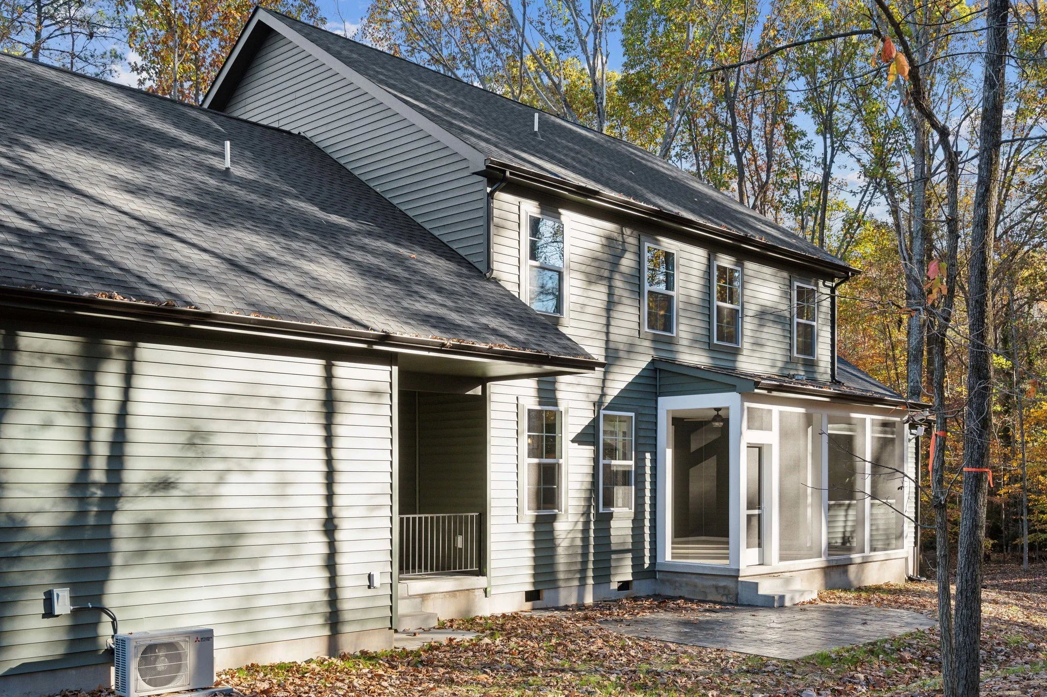 Side angle showcasing a custom two-story home.