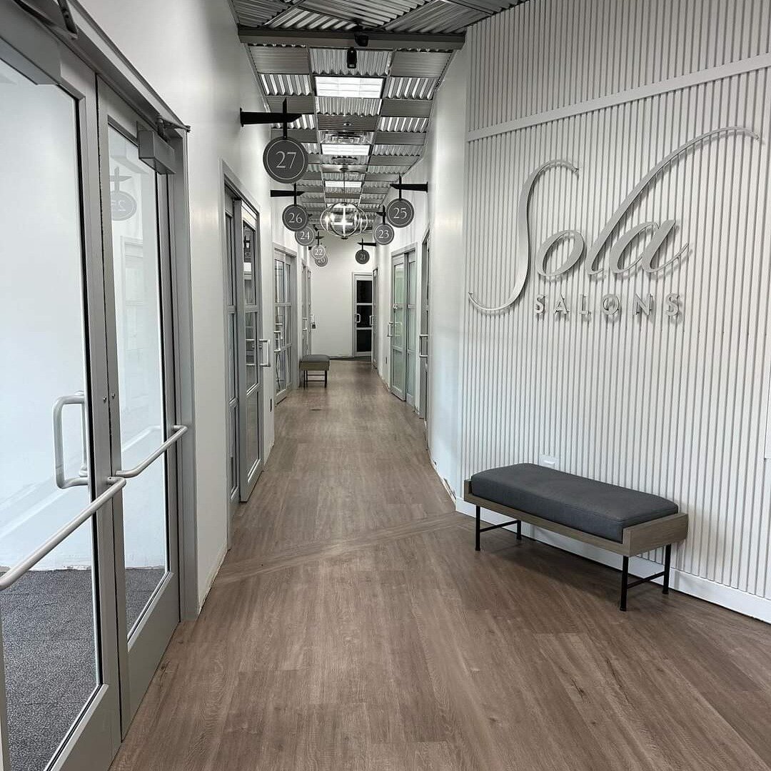 Our Blaine Sola location has recently undergone a little renovation! We have new vinyl flooring, freshly painted walls, new bench seating, and standardized signage above our doors all throughout the hallways giving the salon an updated and modern fee