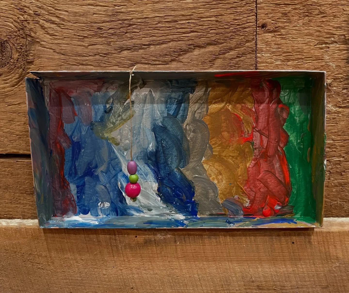 I was so happy to reunite with the Wednesday group today. After sharing stories, we jumped right back into painting with acrylics and exploring color combinations, using the tops of shoeboxes as our surfaces. Each child painted their box silver, then