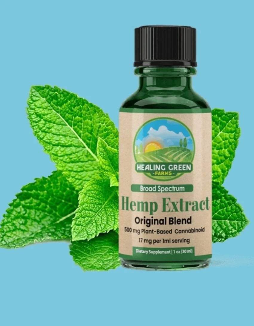 Bottle of Healing Green Farms hemp extract with mint leaves in the background.
