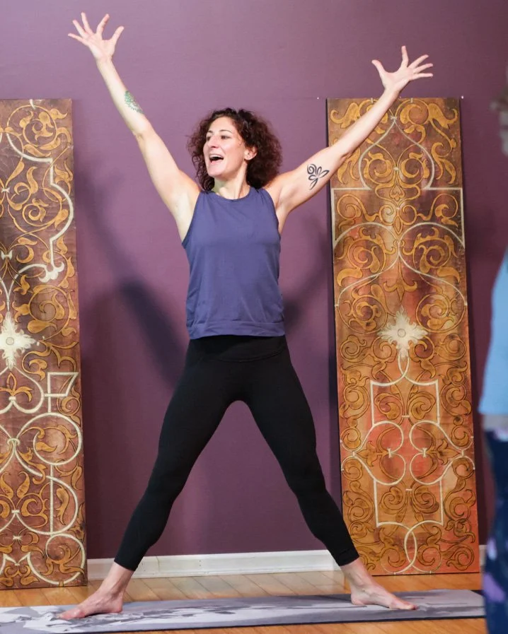Kristen Kauke teaching Vinyasa yoga at Prana Yoga Center in Geneva, Illinois, guiding a dynamic, breath-led practice.