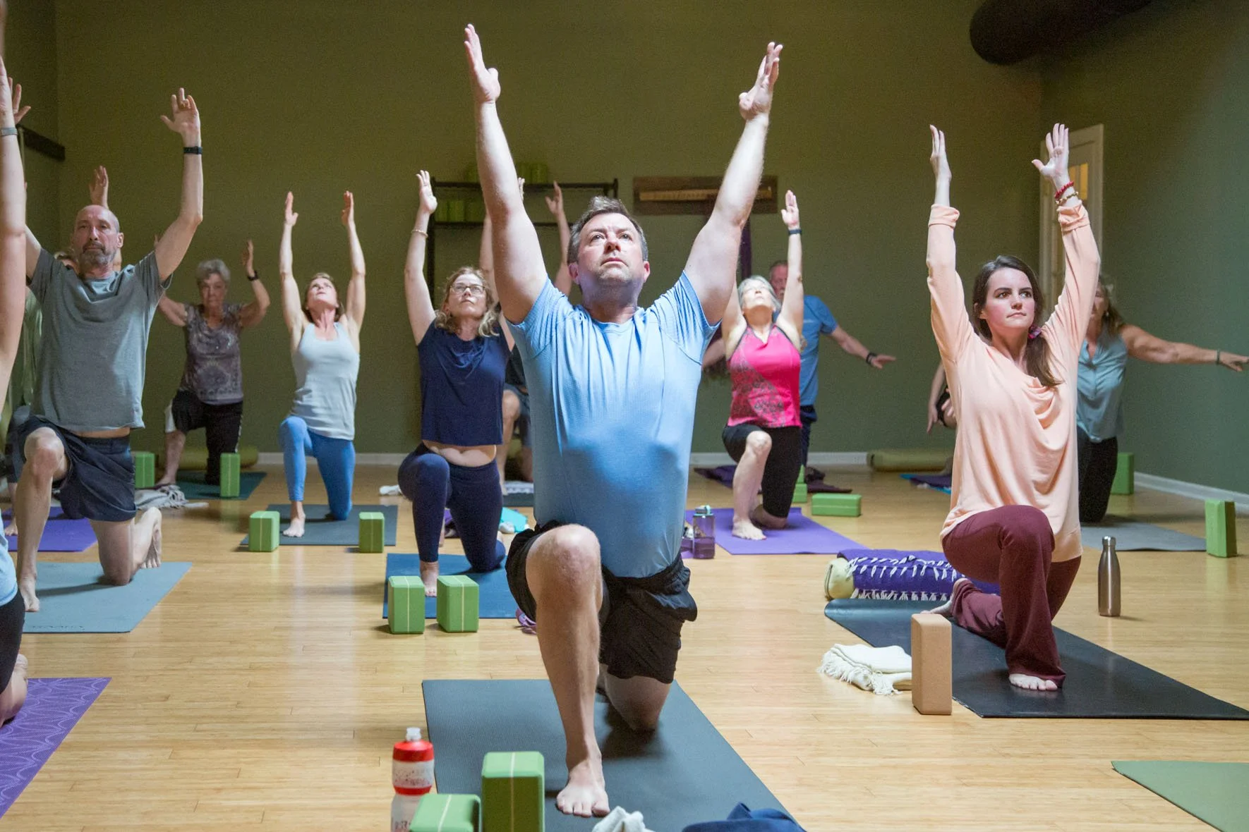 Yoga Students Sitting in pose in Yoga Class