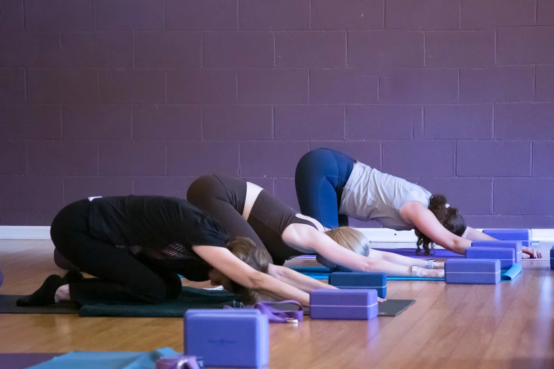 Students in a restorative yoga practice at Prana Yoga Center in Geneva, Illinois.