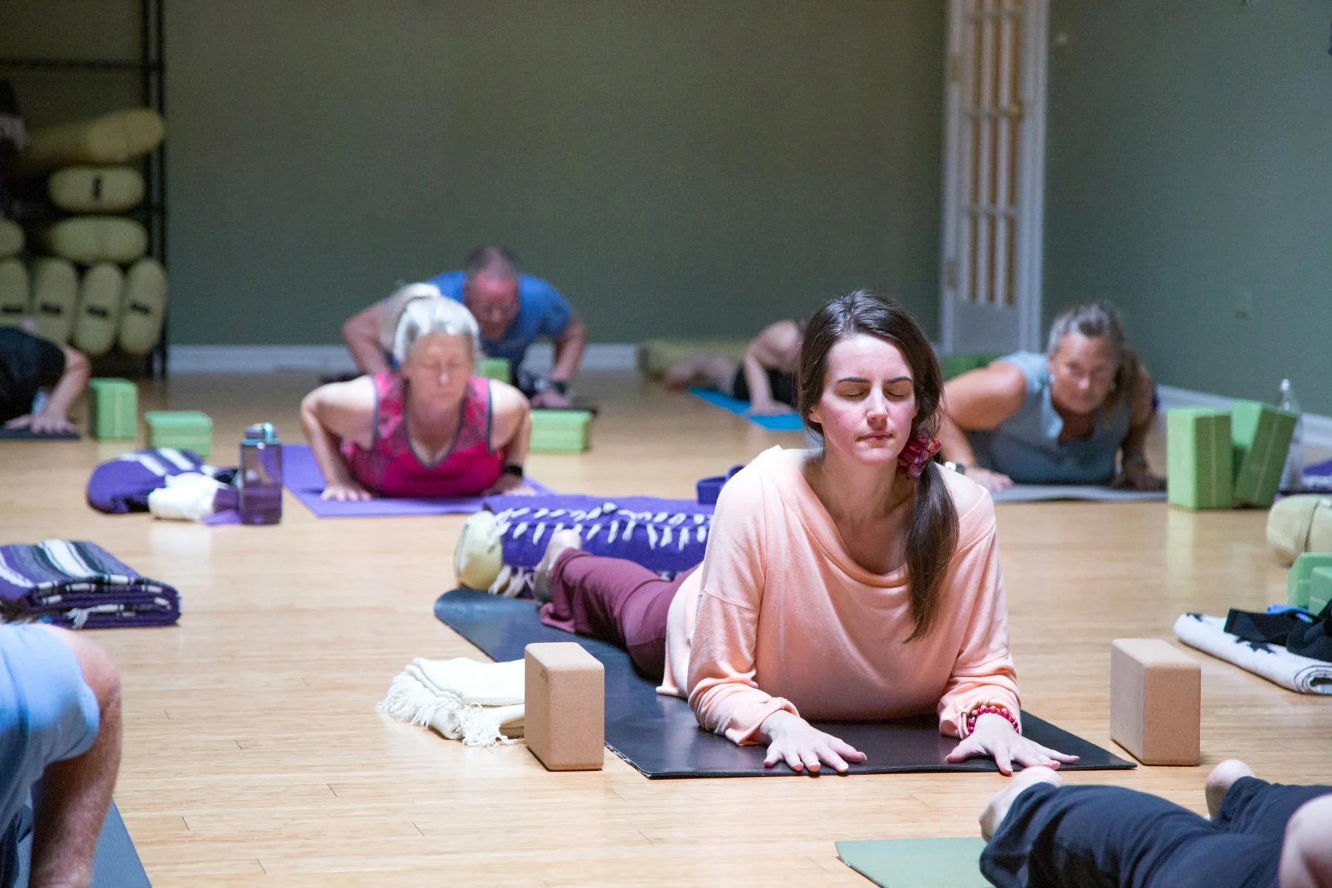 Students practicing yoga together at Prana Yoga Center in Geneva, Illinois.