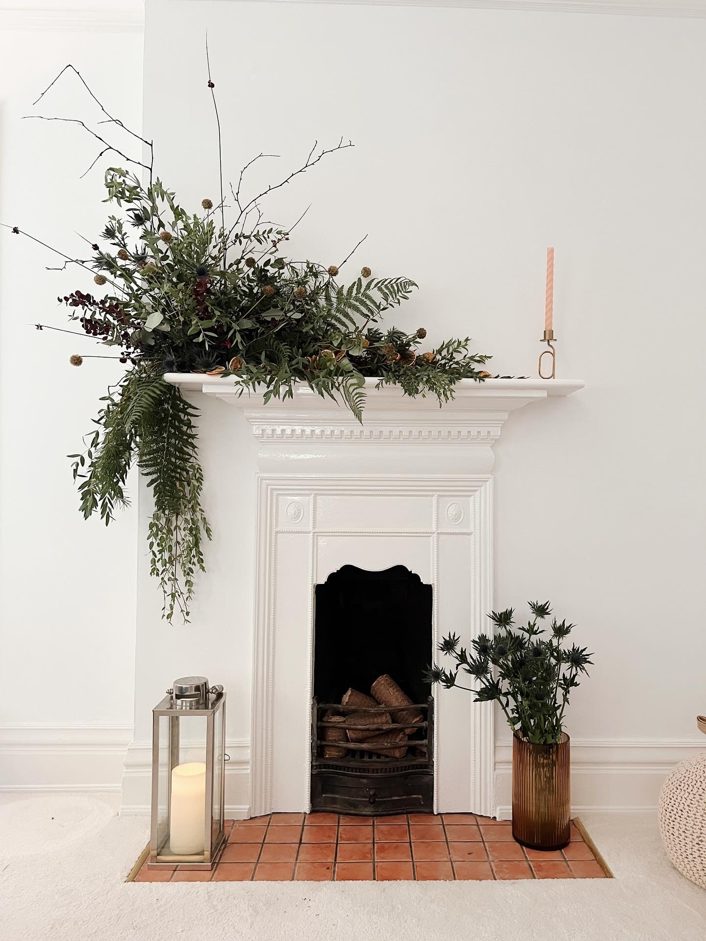A winter mantelpiece display with foraged ferns, branches, thistles and dried oranges 🍊 Created for @yourhomemagazine last year. Who&rsquo;s ready to see some more Christmas crafts? 🌿