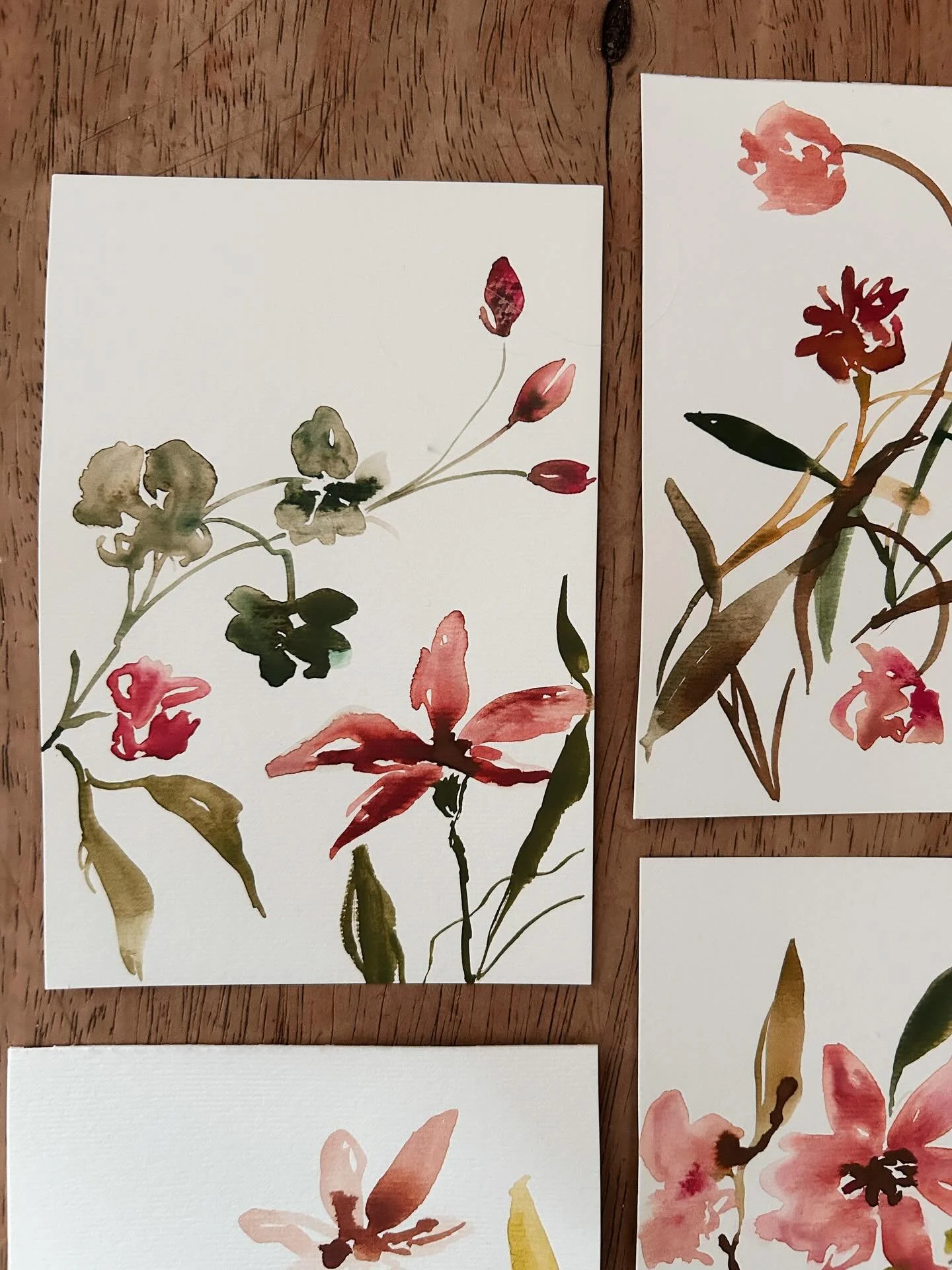 Mini paintings on my desk this morning, with watercolour on textured paper 🌾