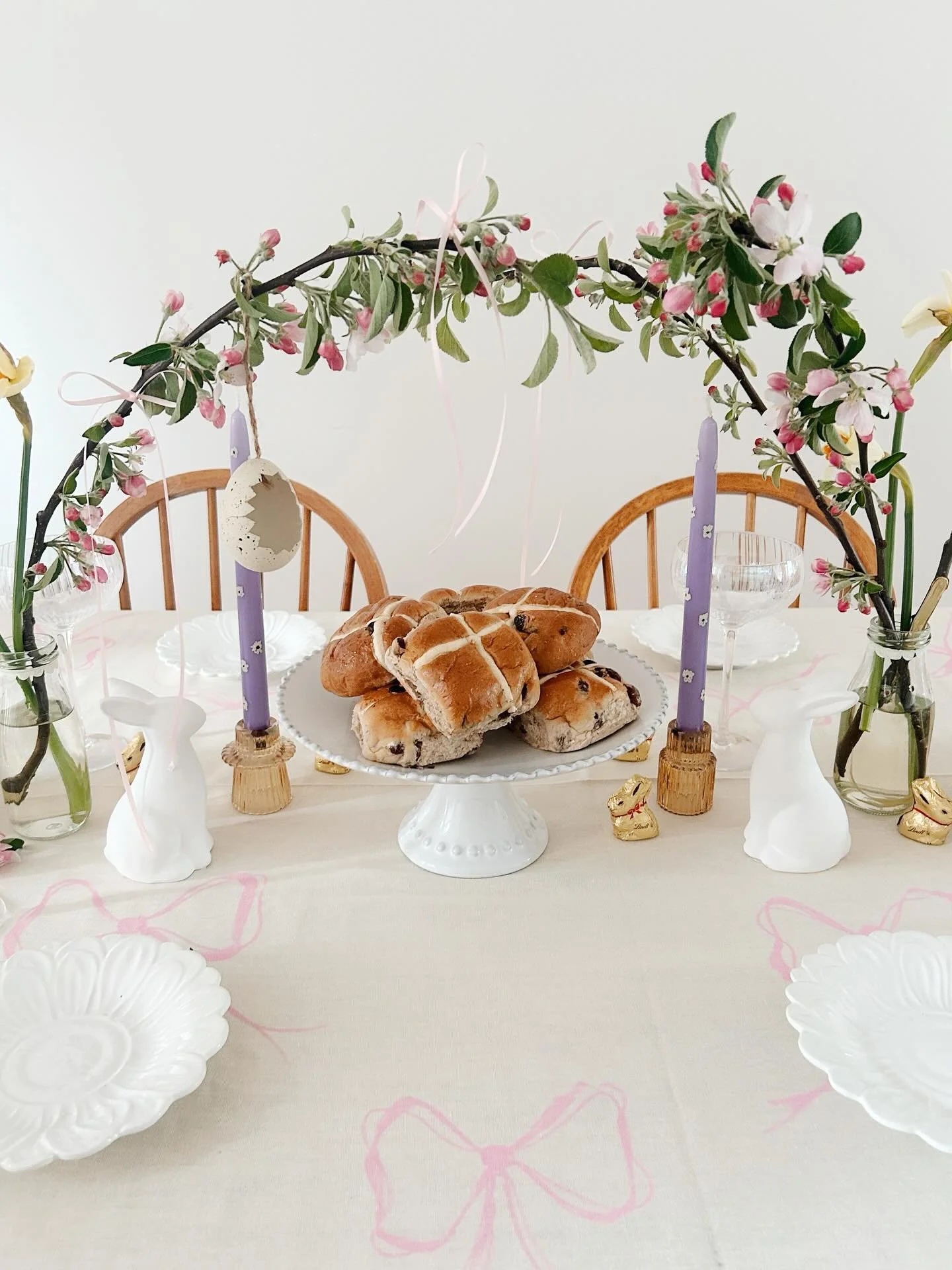A look back at last years crafted Easter table 🐰 With a hand illustrated tablecloth, hand painted candles, decorated bud vases, ceramic bunnies &amp; ribbons on apple blossom branches 💫