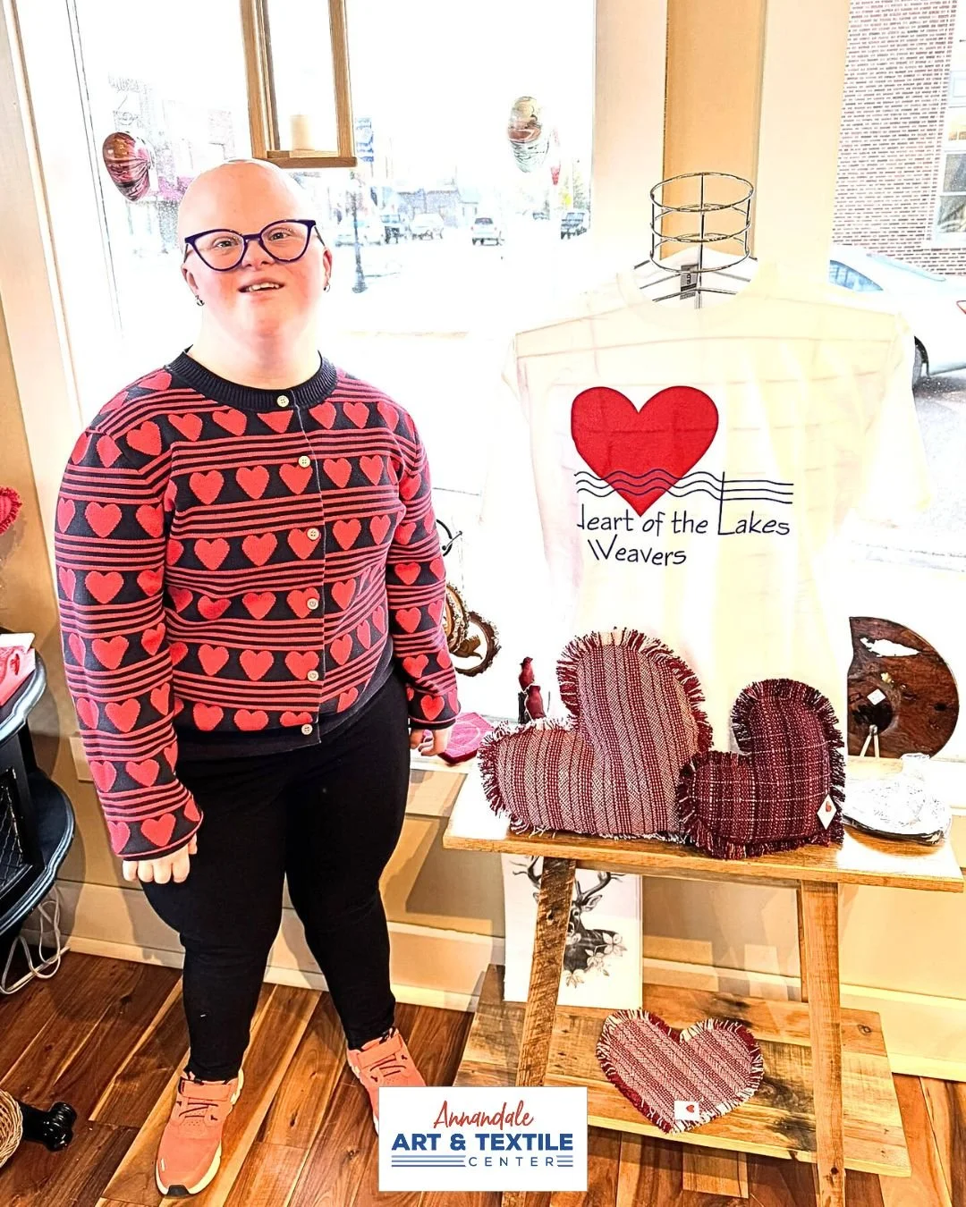 Hearts are big here at AATC as Heart of the Lakes weaver Abby shows! Stop in and shop our gift gallery which is full of gorgeous handmade items ready to decorate your homes. (Check out the fabulous woven heart pillows next to Abby in the picture!)

O