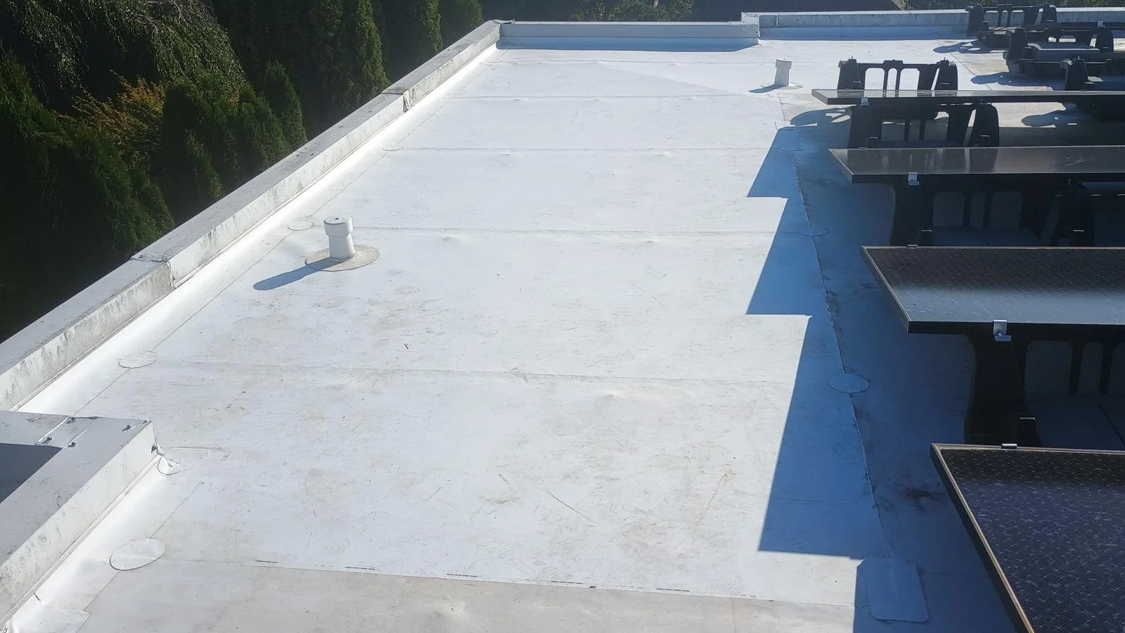 Flat roof with new white membrane roofing