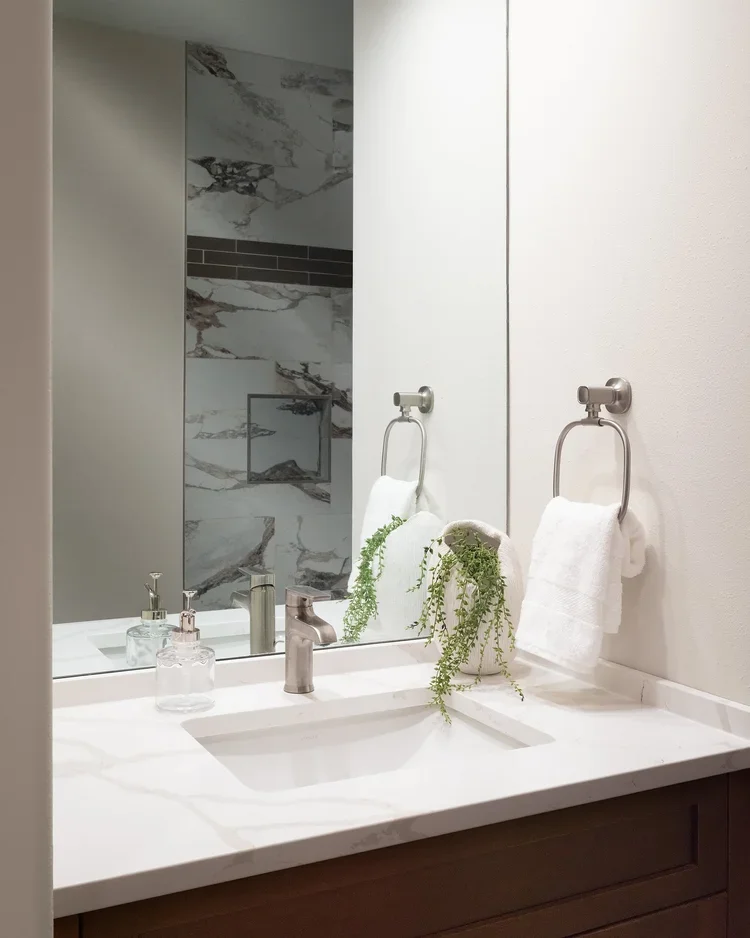 White undermount sink with quartz countertop and modern faucet