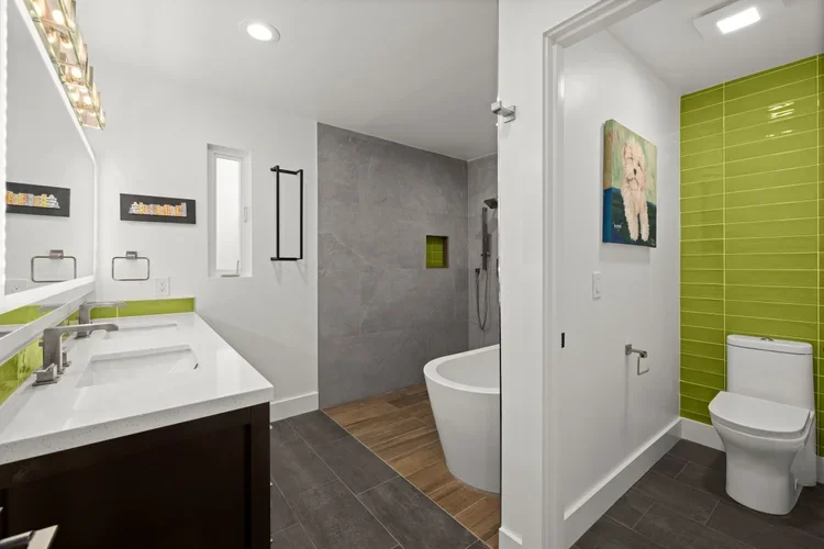 Bathroom remodel with green accent tile wall, tub and walk-in shower