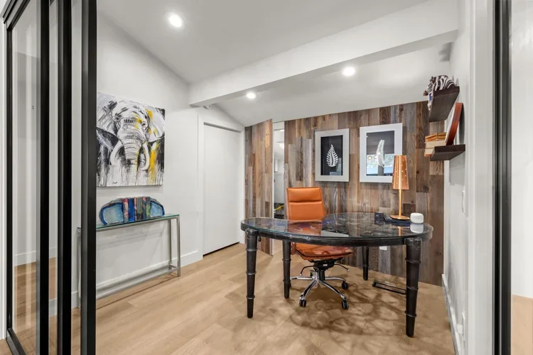 Home office with wood accent wall and modern desk