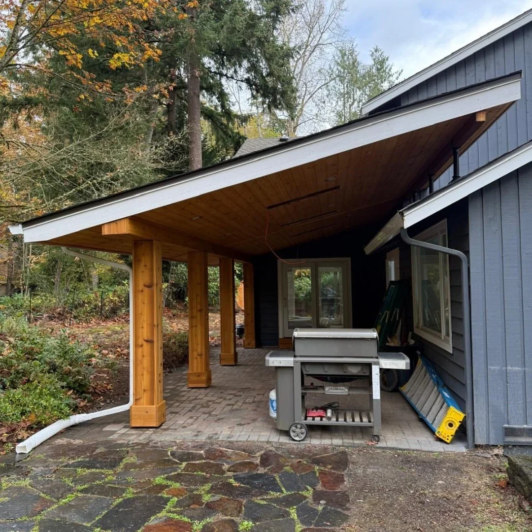 Covered patio with cedar posts, shed roof and stone pavers