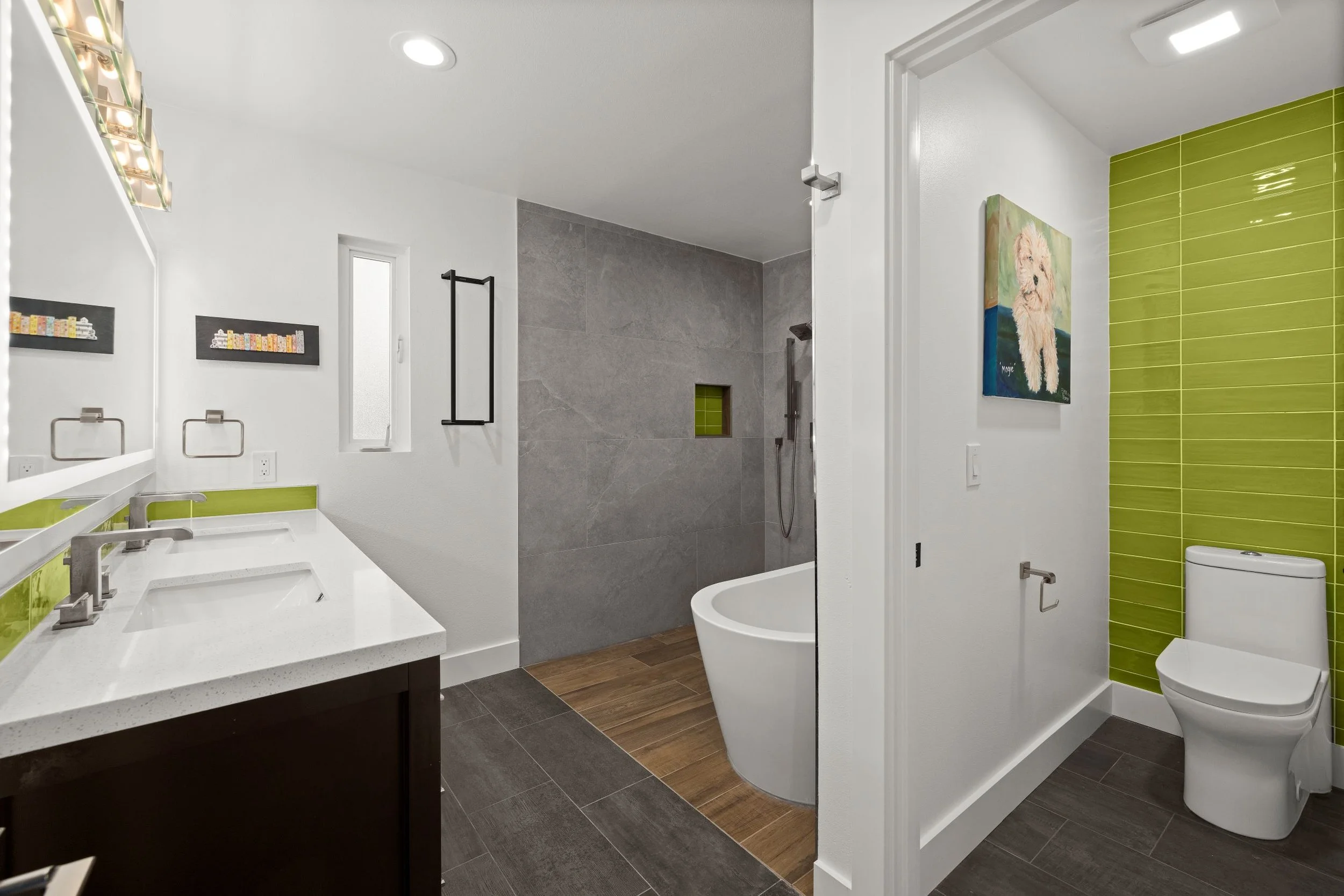 Bathroom remodel with green accent tile wall, tub and walk-in shower
