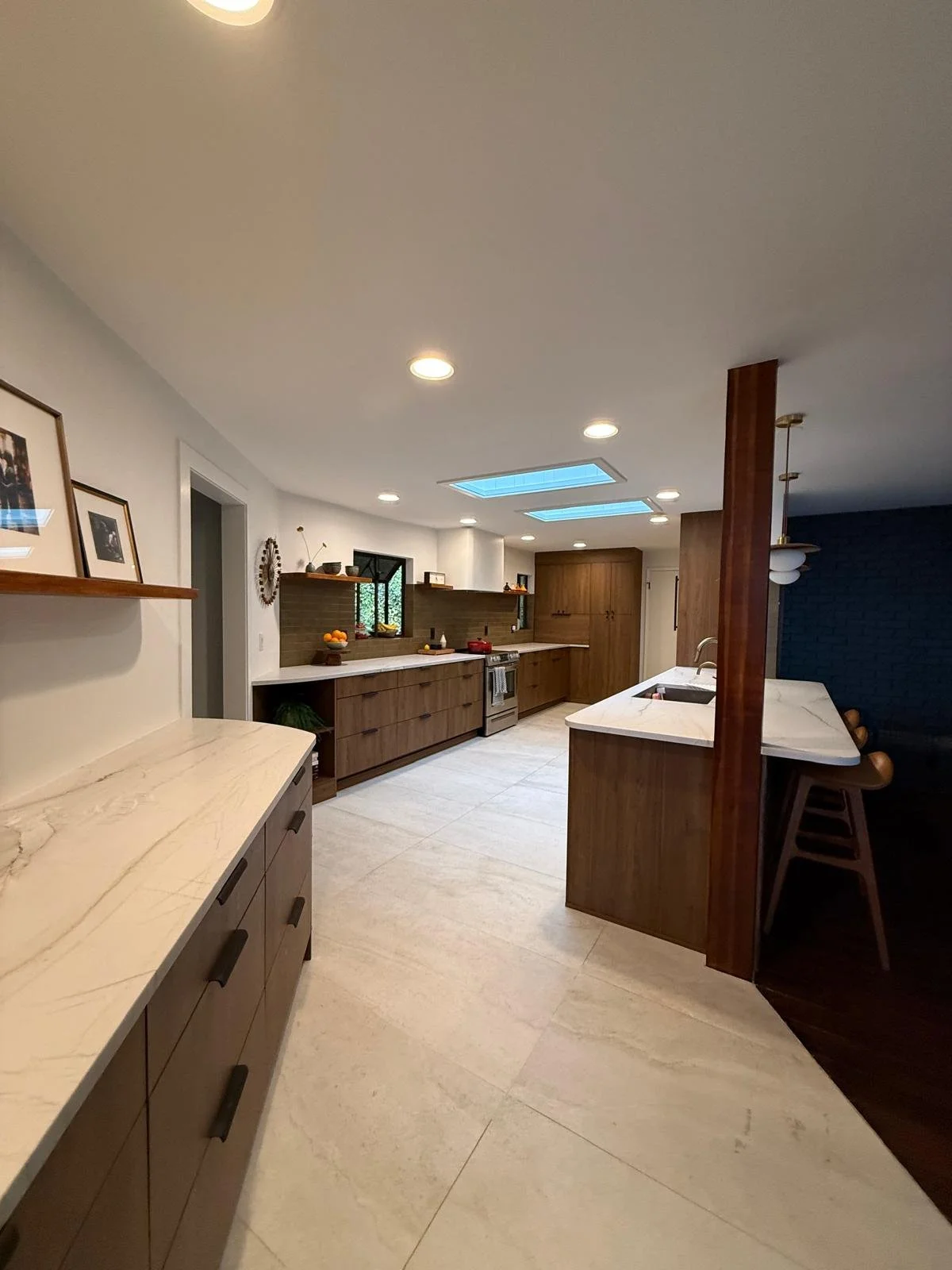 Open kitchen with exposed wood support post and long counter