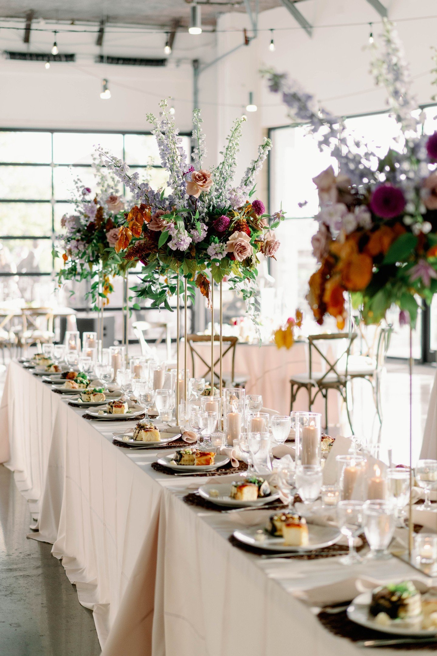 A balanced mix of family style &amp; round reception tables are a favorite of mine. It really draws the eye to your details and elevates your design and overall guest experience🤝🏼