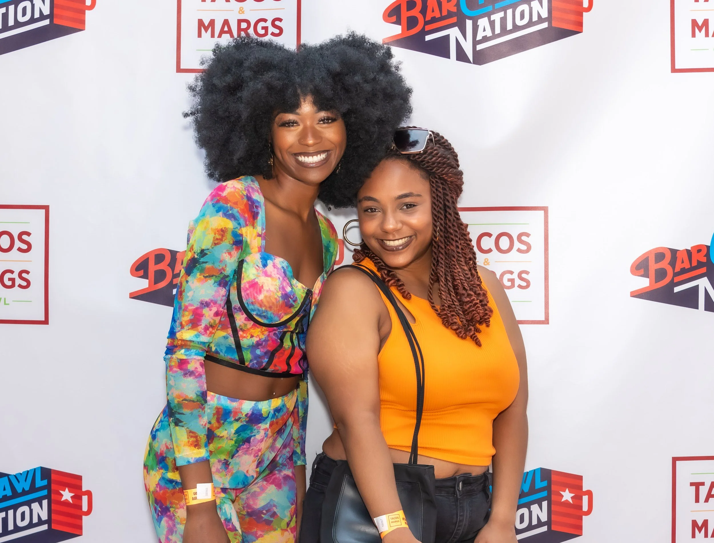 Two girls in front of Step and Repeat - Deep Ellum, TX