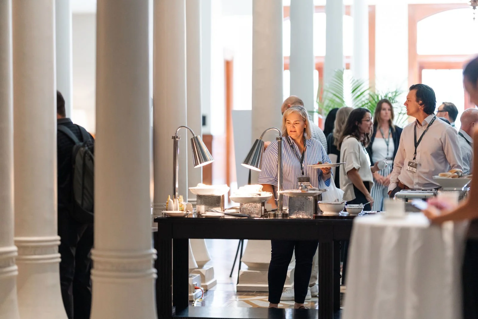 Conference attendees gathering during a refreshment break