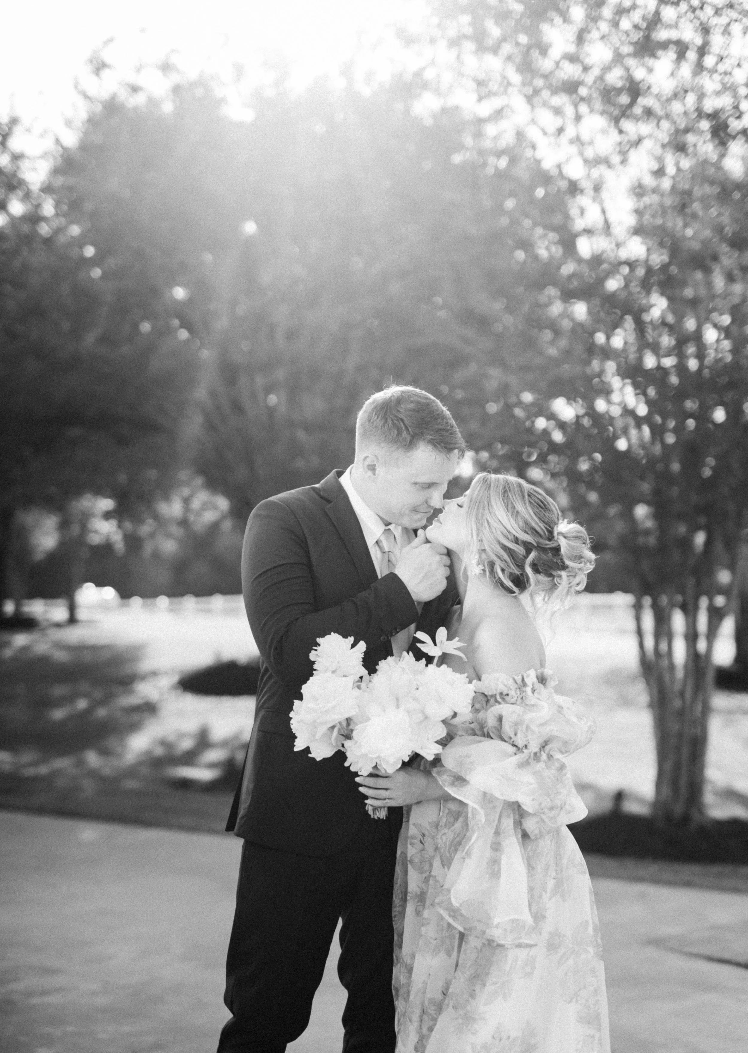 In love couple getting super cozy and intimate while they are about to share a kiss on their wedding day.