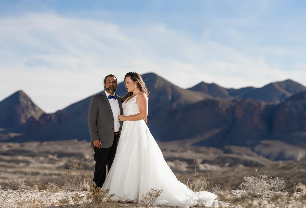 Misty and Jay celebrating their own love story in a desert landscape
