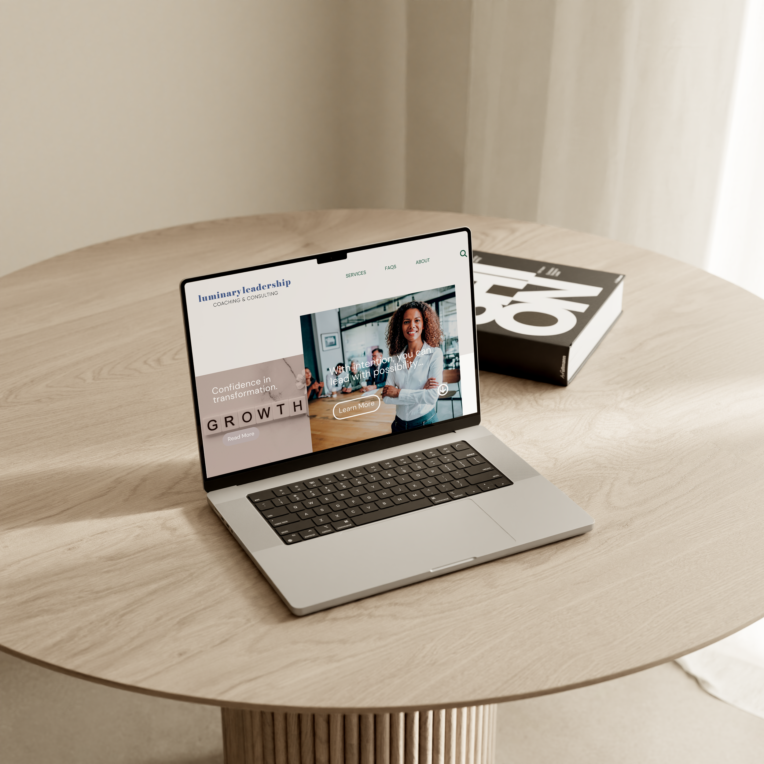 Laptop mockup on a simple round wooden table of a website design