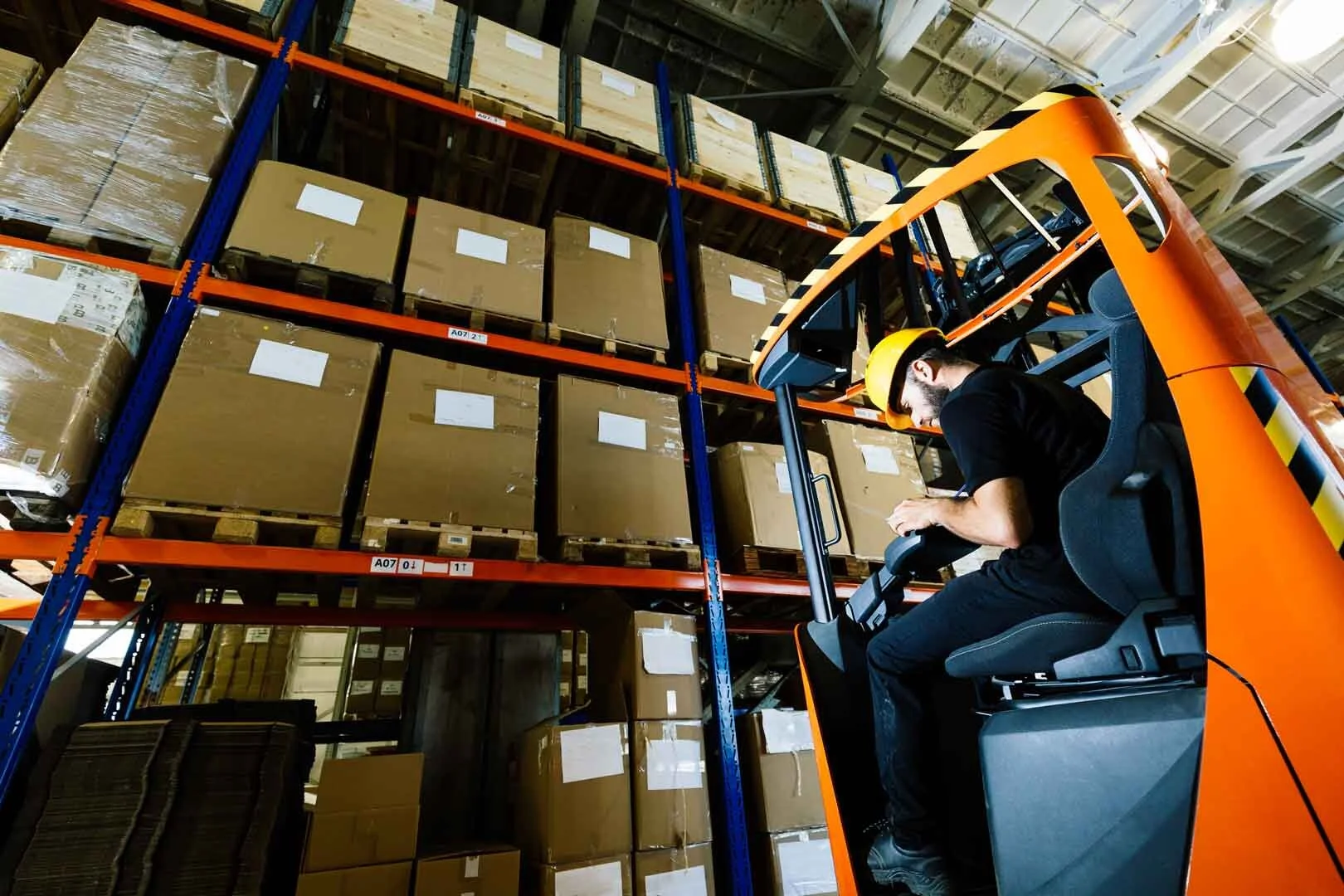 warehouse-worker-doing-logistics-work-with-forklif-PP54DDB.jpg