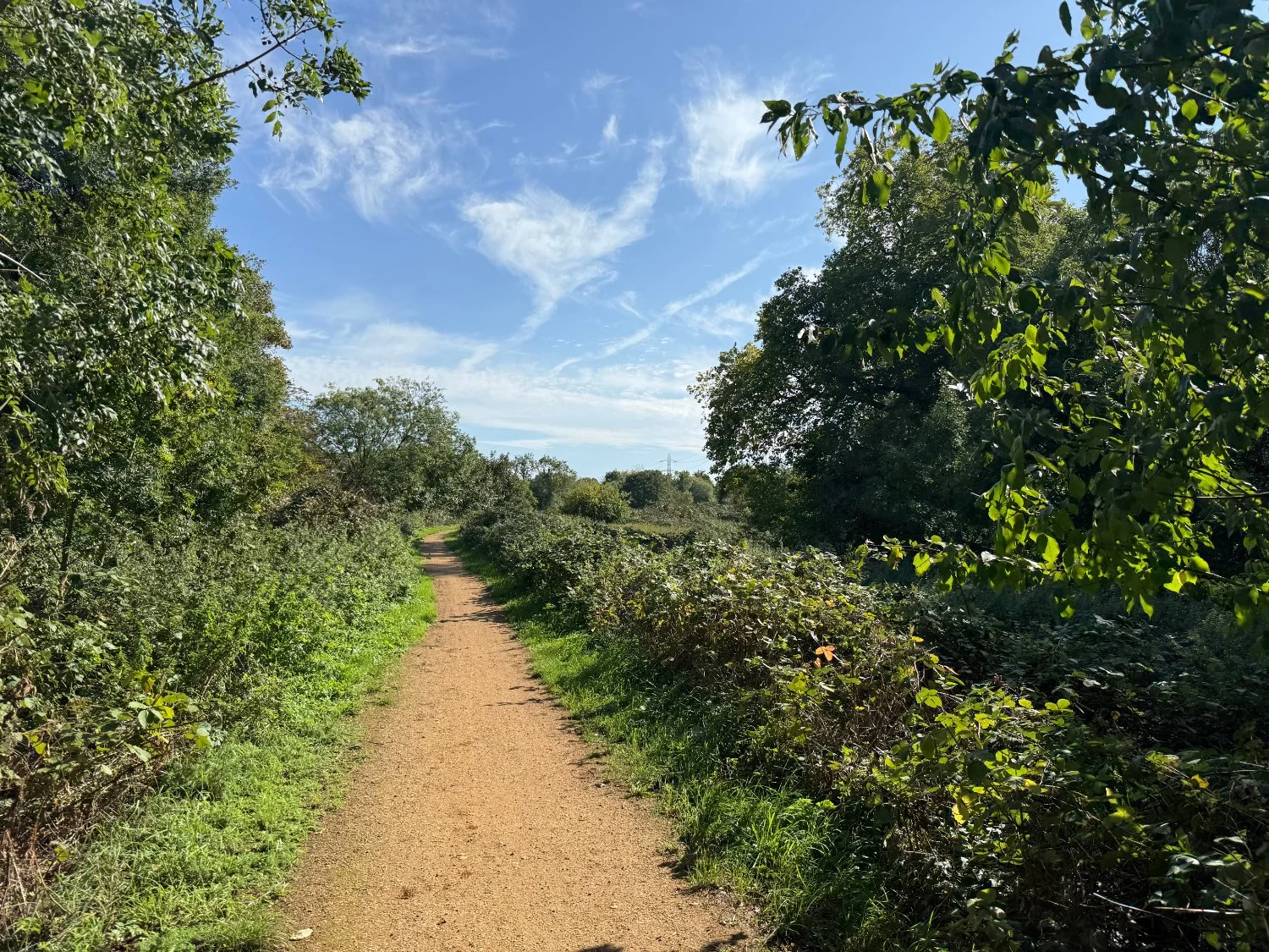 Gravel cycle path beside the river Rom