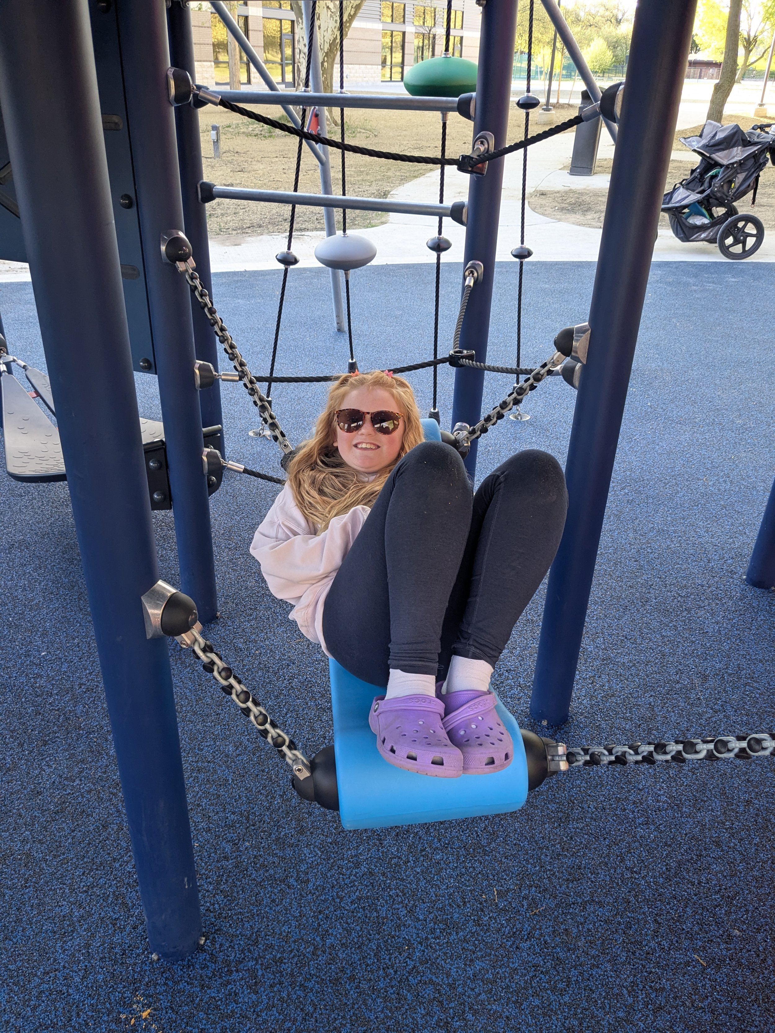Kids enjoying a new playground at MLK Park in Grand Rapids