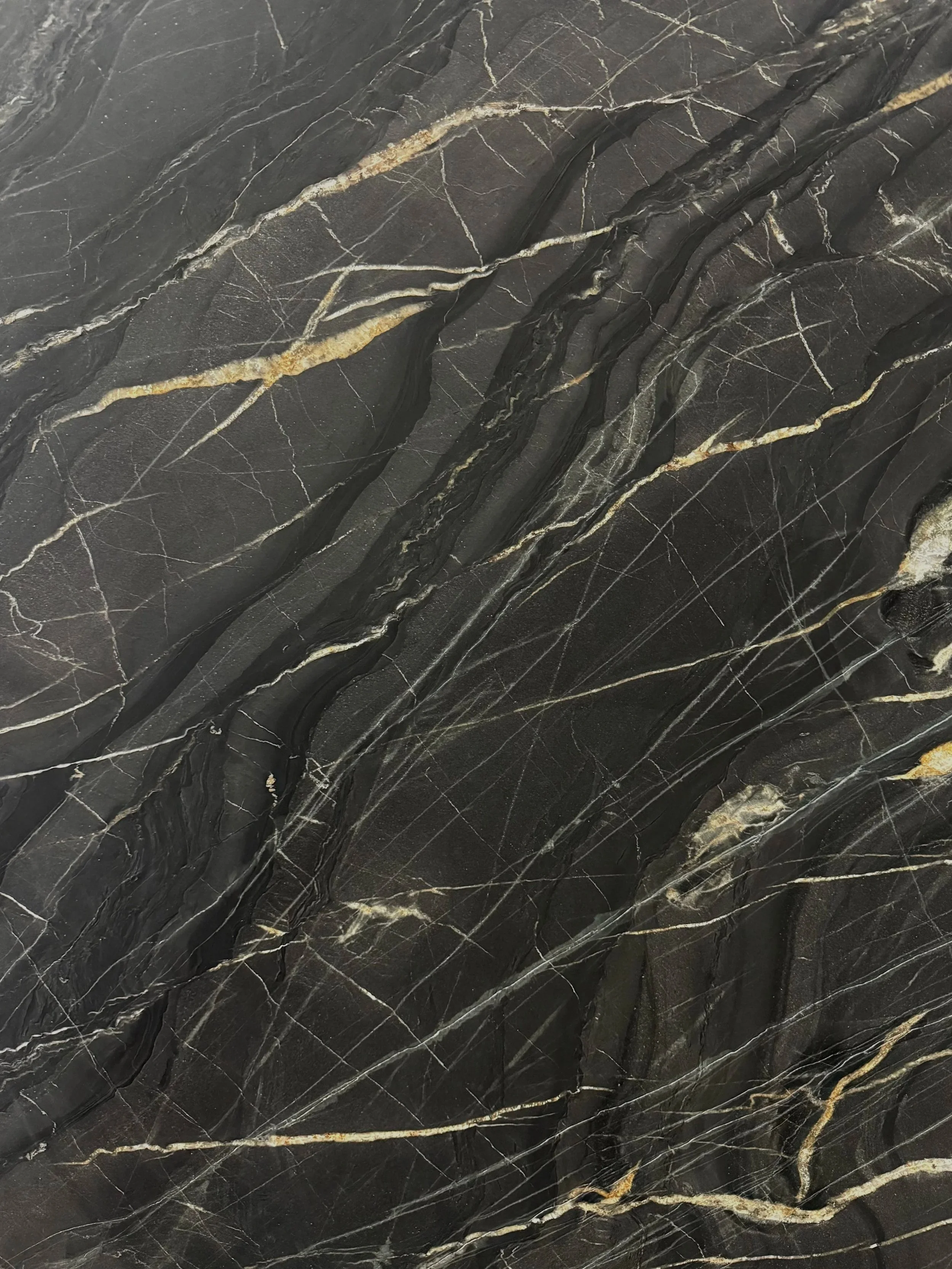 BELVEDERE: Primary Color(s): Black | Available Finishes: Leathered | Variations: Medium