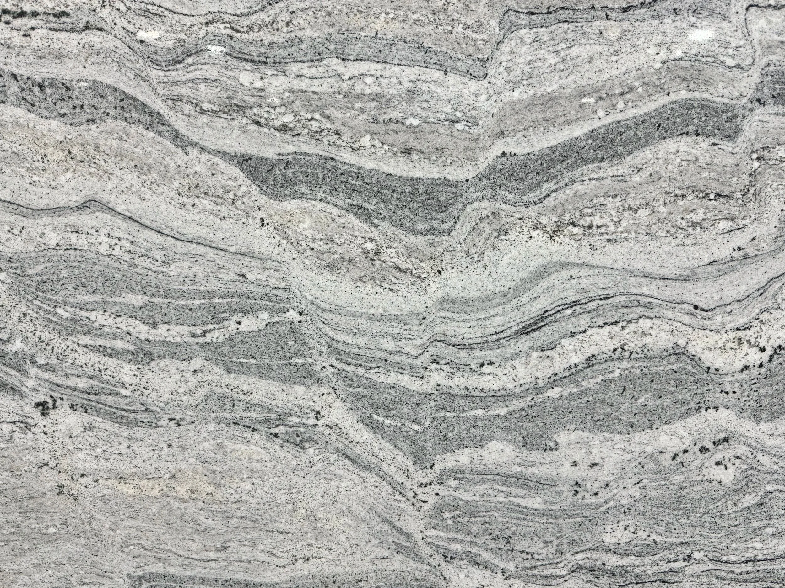 PIRACEMA LIGHT/WHITE WAVE: Primary Color(s):  White, Grey | Available Finishes: Polished/ Brushed | Variations: Medium