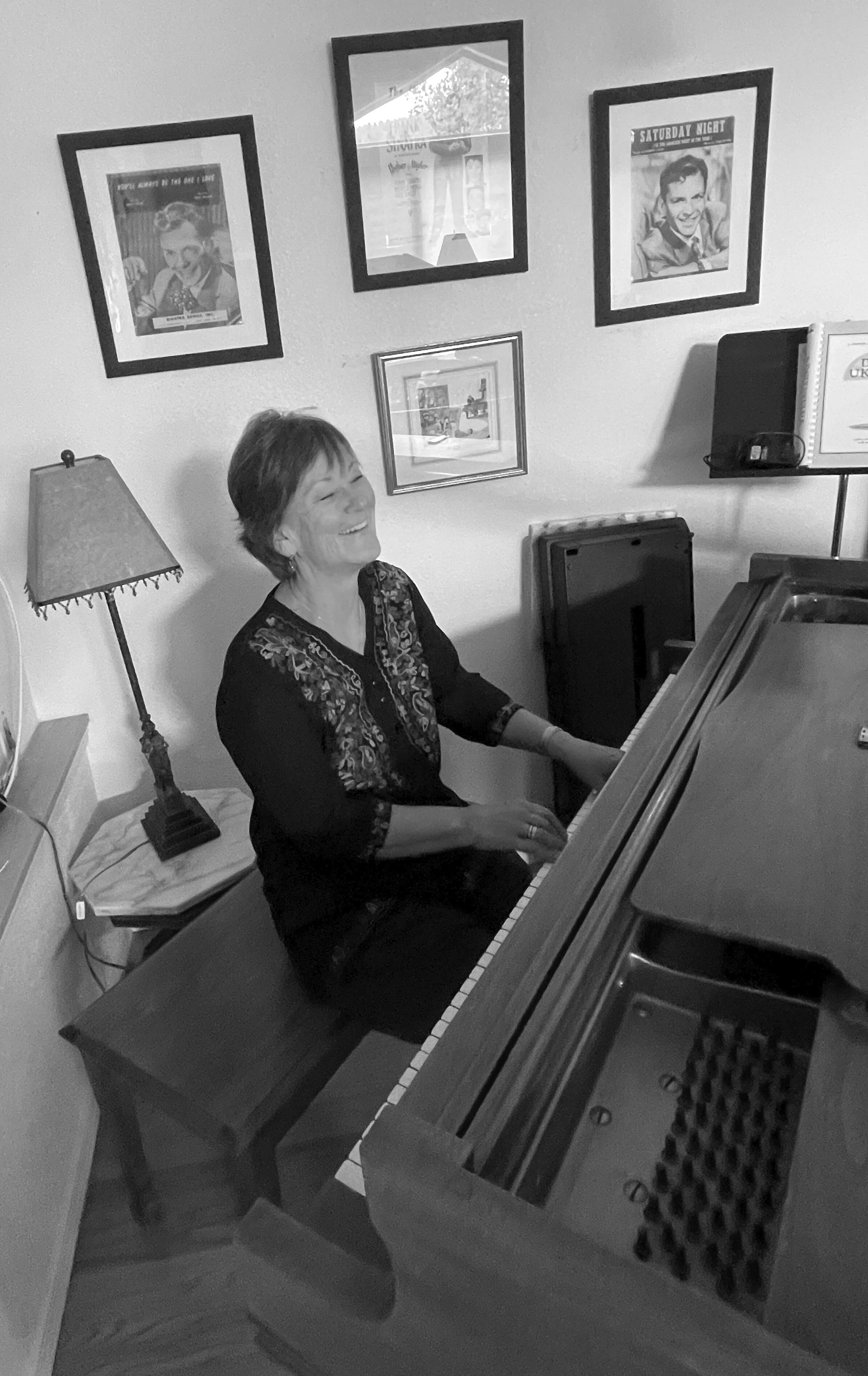 About Briggs Geister_singing at Piano_B&W.jpg